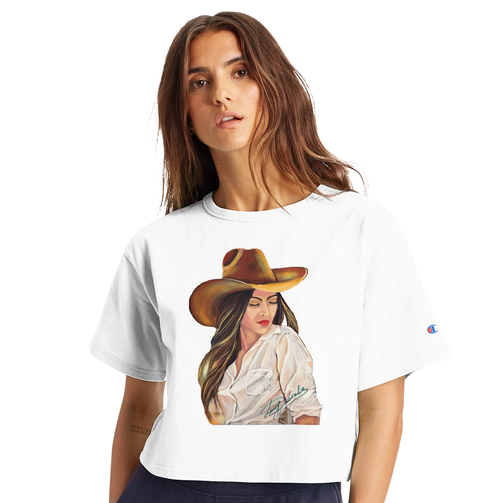 Woman wearing a white t-shirt with a graphic of a woman in a cowboy hat and sunglasses.