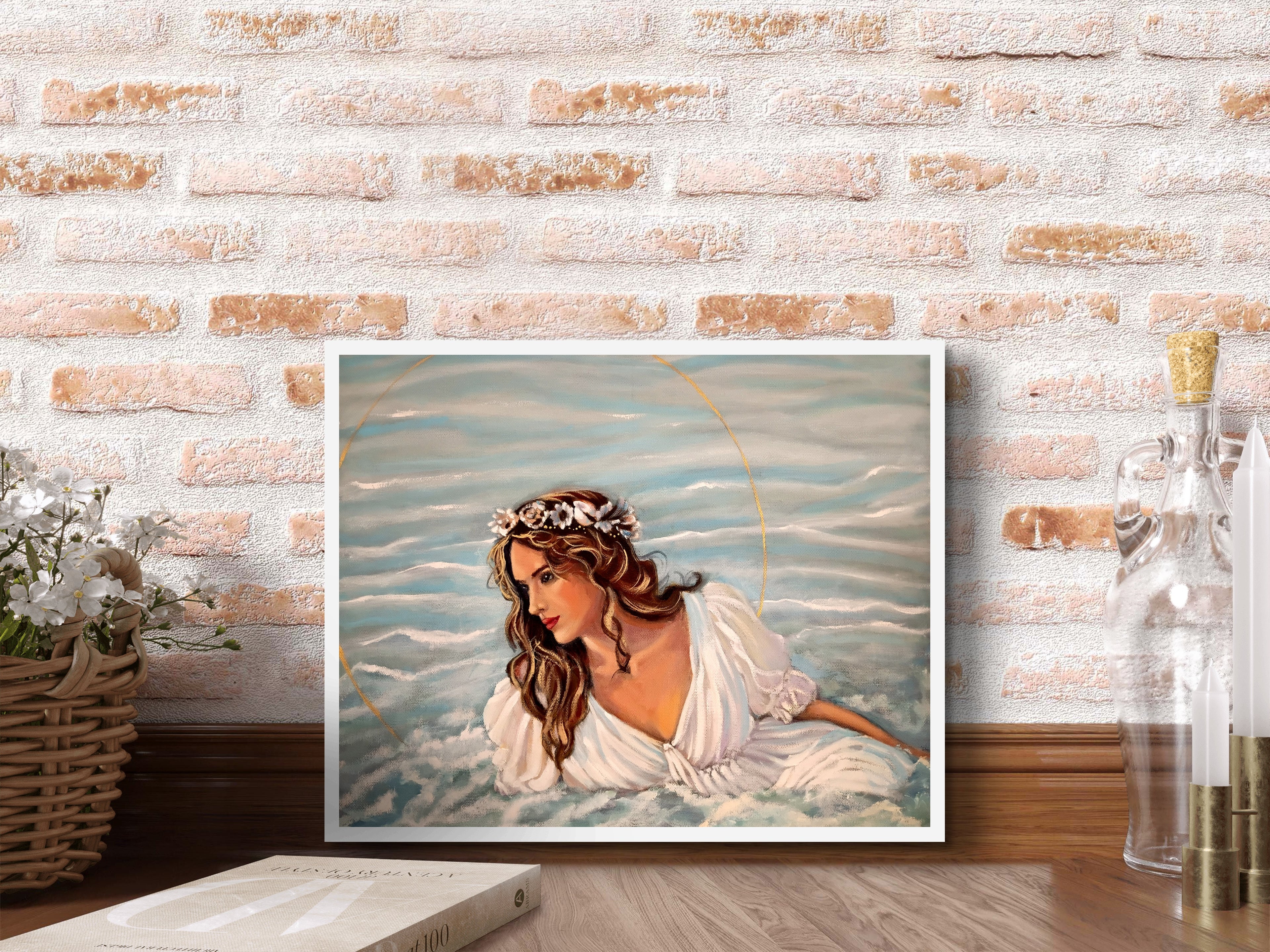 Framed artwork of a woman with long hair against a brick wall.