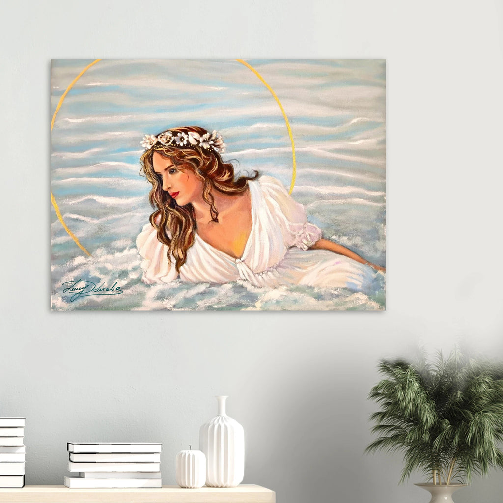 Canvas print of a woman in a white dress with a halo against a sea background, displayed on a wall.