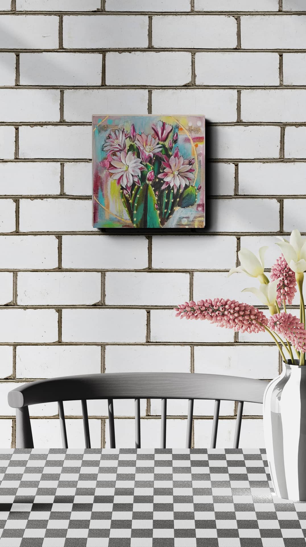 Colorful floral painting on a white brick wall above a checkered table with a chair.