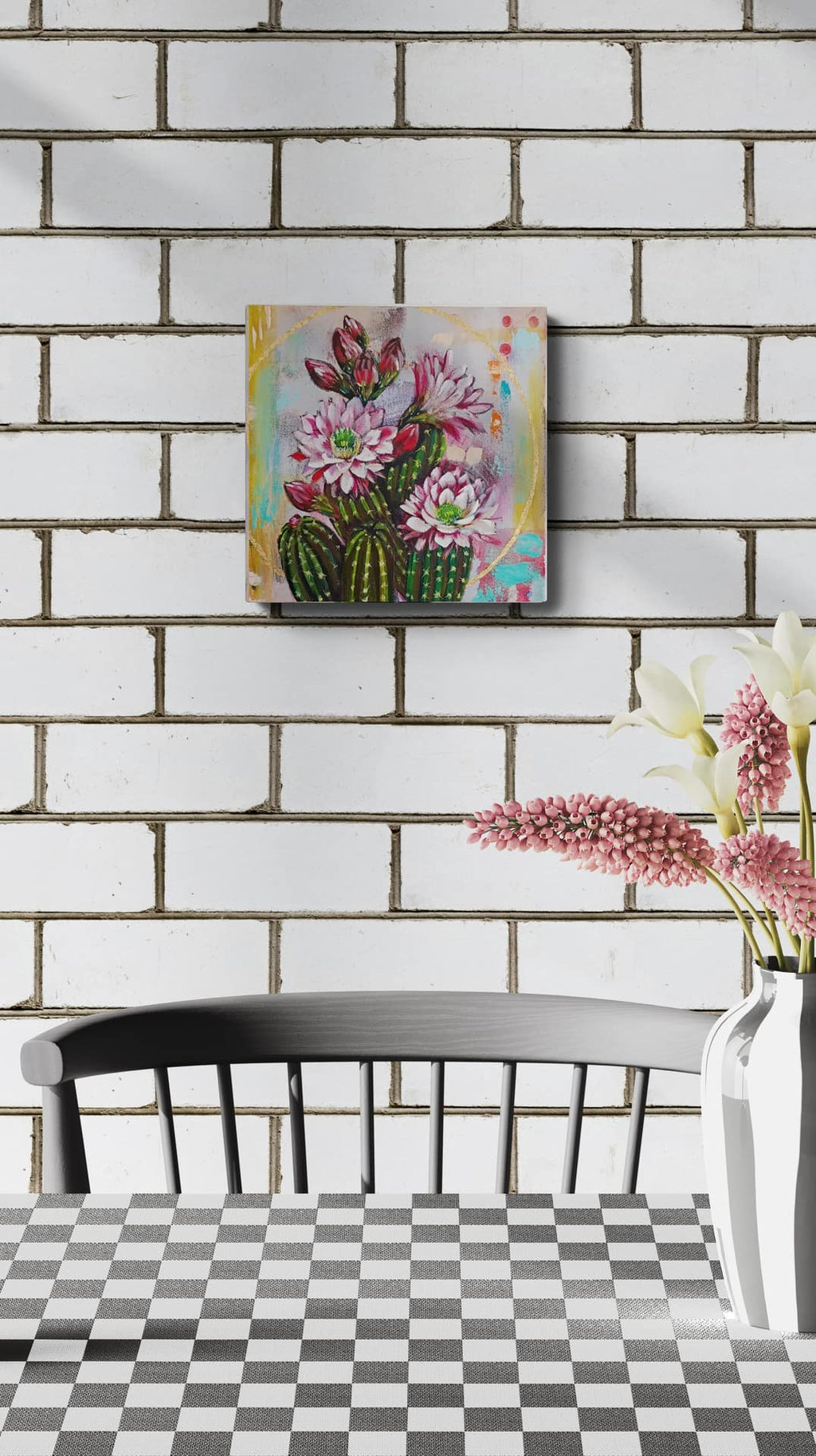 Decorative painting of flowers on a brick wall with a chair and vase in the foreground.