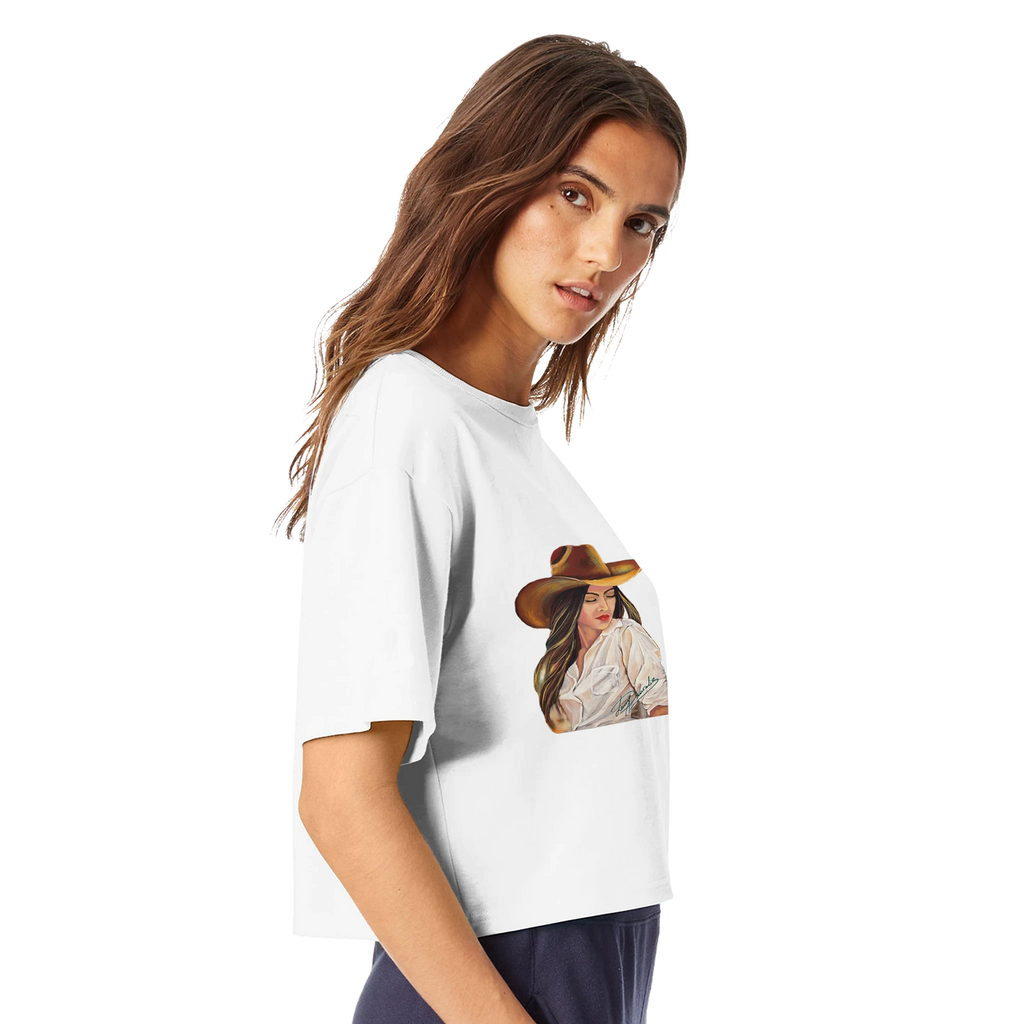 Woman wearing a white t-shirt with a printed image of a woman in a hat and dress.