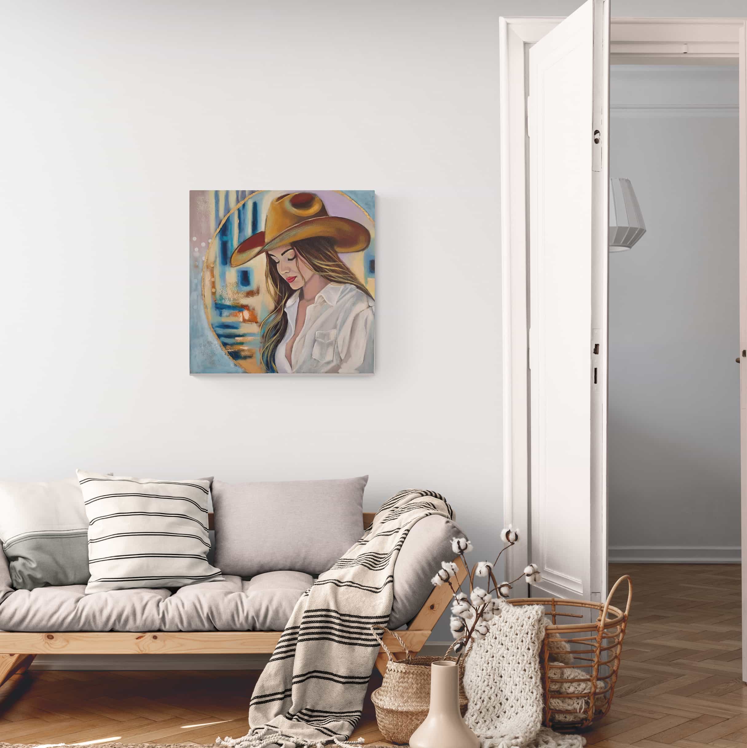 Living room with a sofa, decorative pillows, and a painting of a woman wearing a hat on the wall.