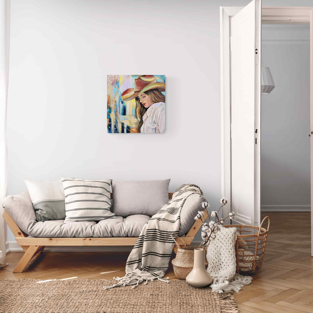 Living room with a sofa, decorative pillows, and a painting on the wall.