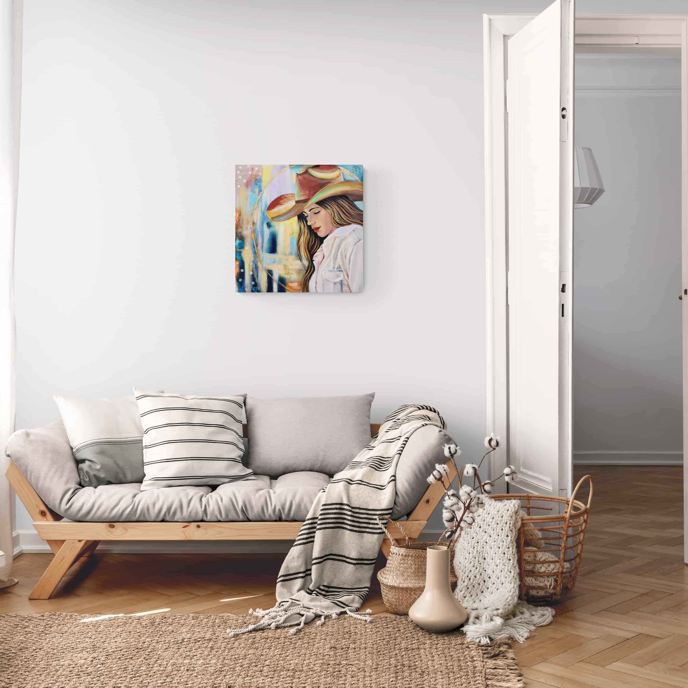 Living room with a sofa, decorative pillows, and a painting on the wall.