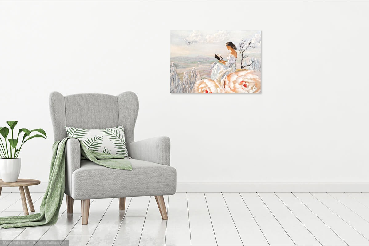 Gray armchair with a green blanket and pillow in a room with a wall painting of a woman reading a book by a lake.