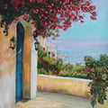 Balcony with pink flowers, blue door, and ocean view