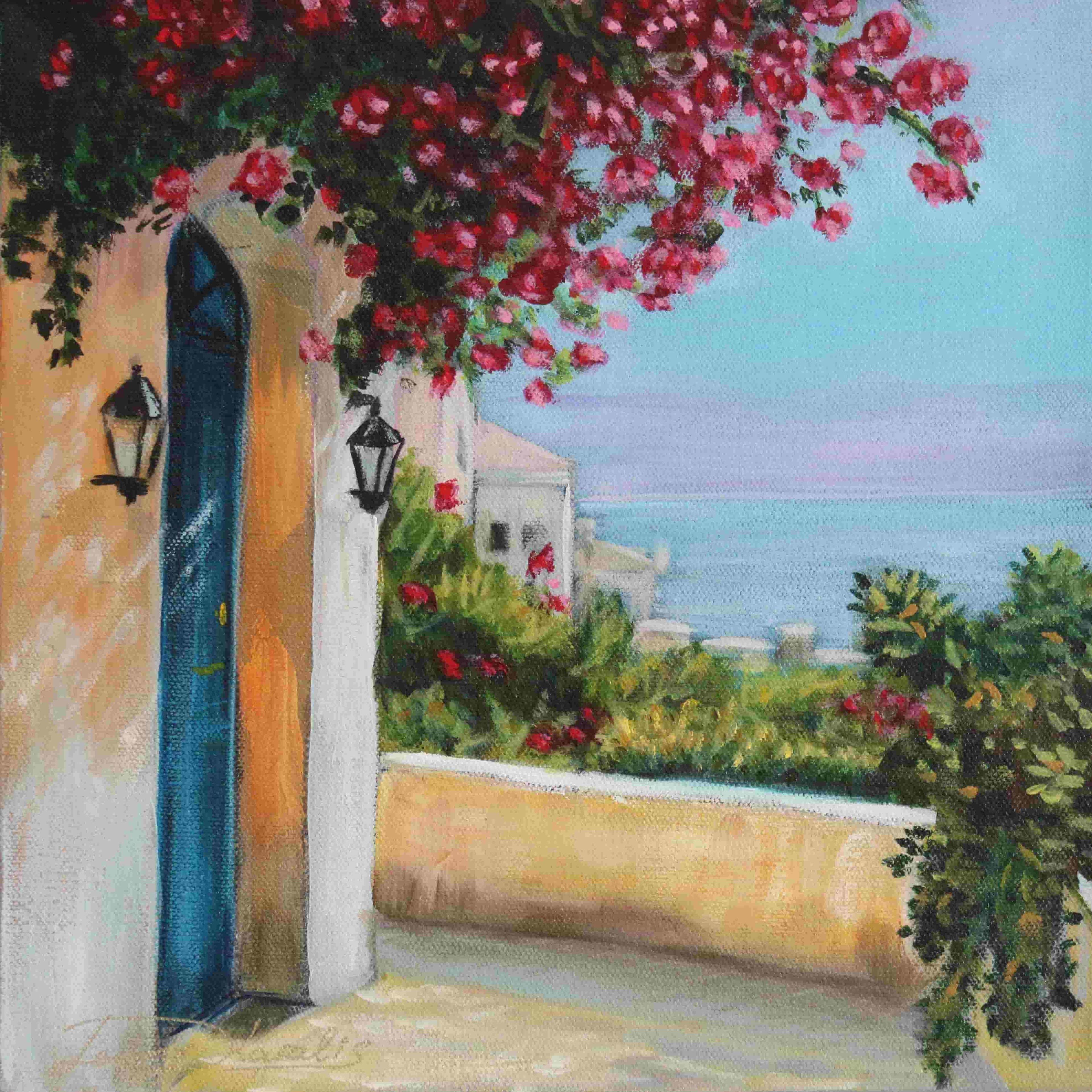 Balcony with pink flowers, blue door, and ocean view
