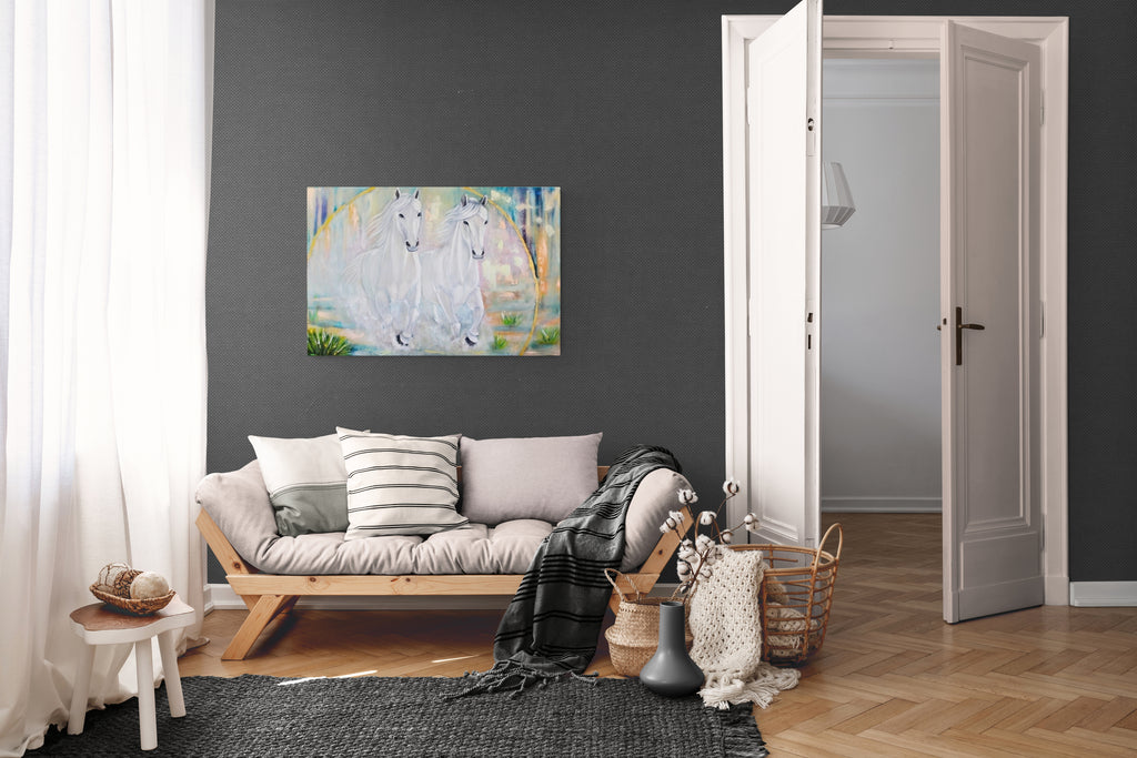 Living room with a gray wall, wooden floor, and a painting of two white horses on the wall.