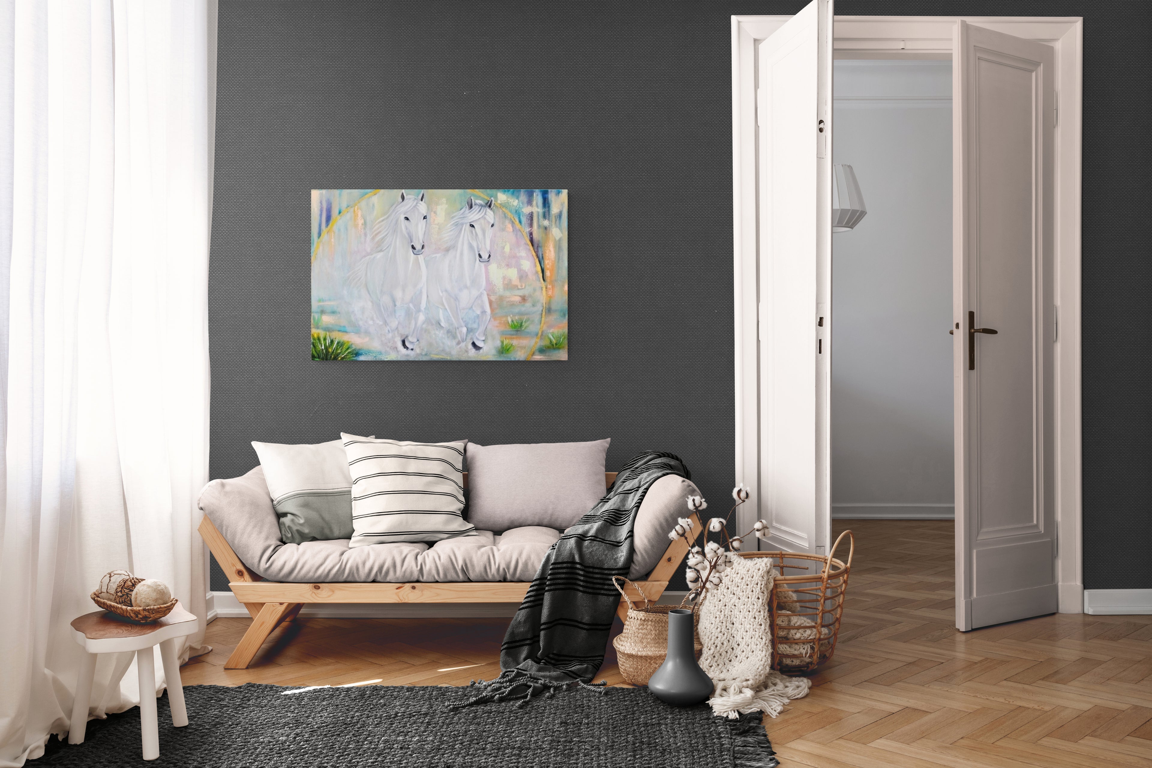 Living room with a gray wall, wooden floor, and a painting of two white horses on the wall.