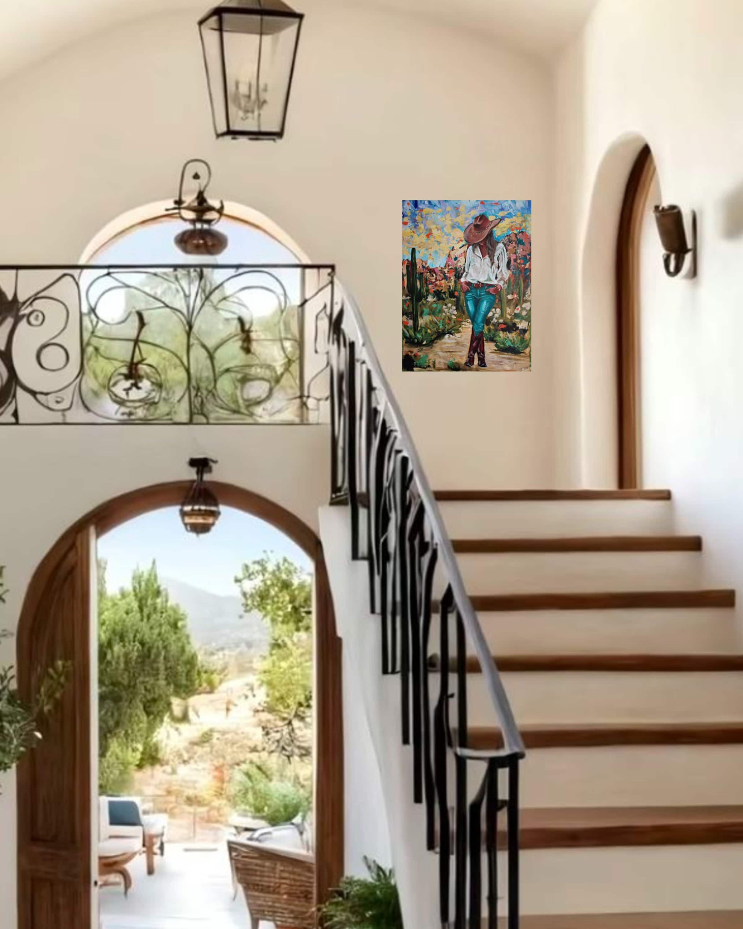 Staircase with black railings leading to an artwork of a woman with cowboy hat.