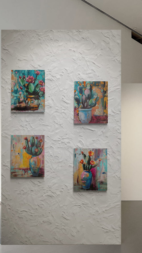 Four colorful paintings of floral and cactus scenes on a textured white wall.