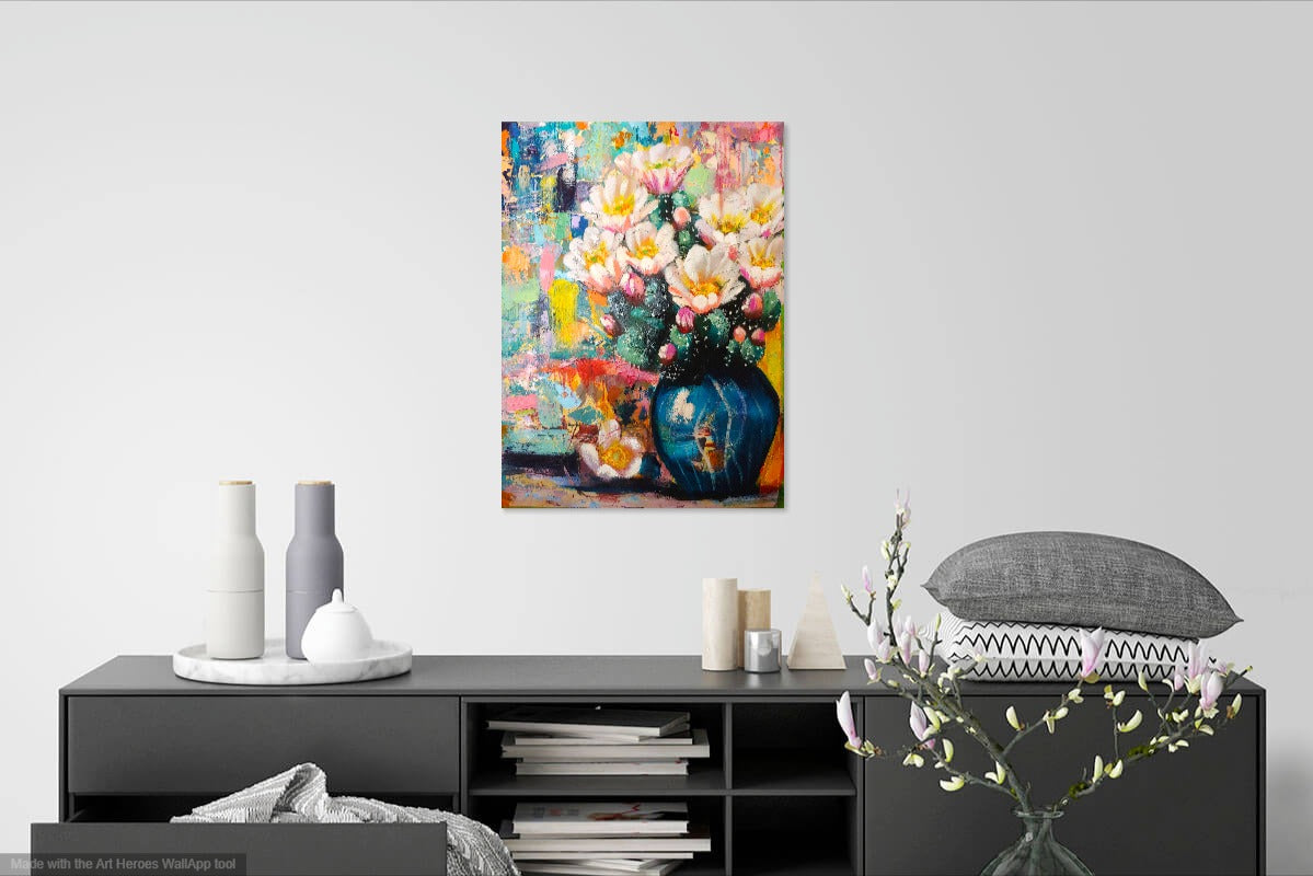 Colorful abstract painting on a wall above a black console table with decorative items.